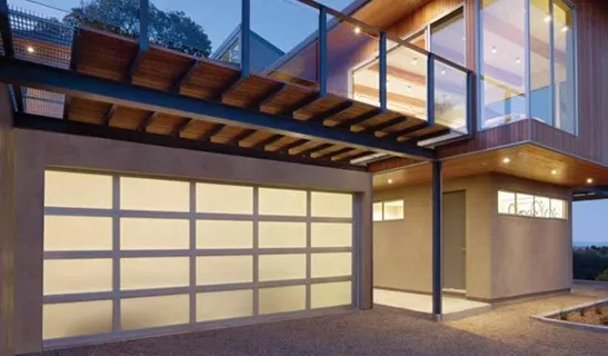 Modern Aluminum Garage Door with frosted panels with light shining through